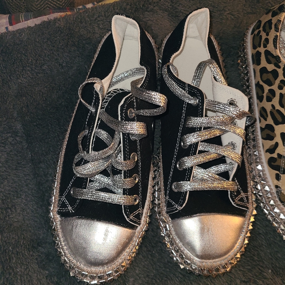 Black cloth tennis shoes with silver laces